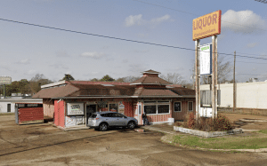 Man arrested after allegedly running over person at Jackson liquor store